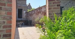 Maison deux chambres avec garage et jardin